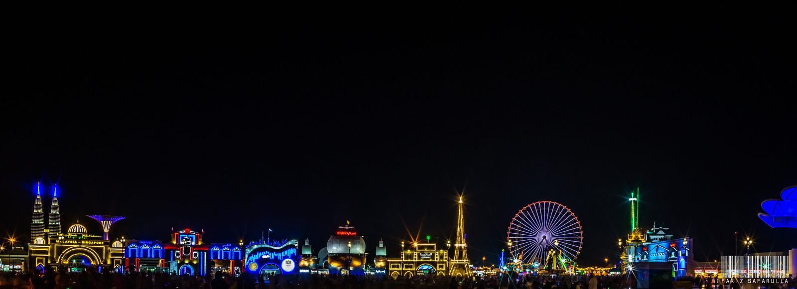 Panoramic night view of Global Village Dubai with illuminated pavilions
