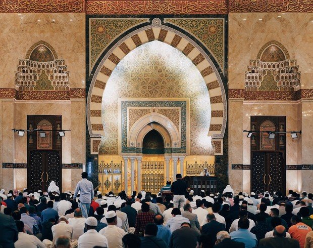 Al Satwa Big Mosque prayer hall with worshippers praying
