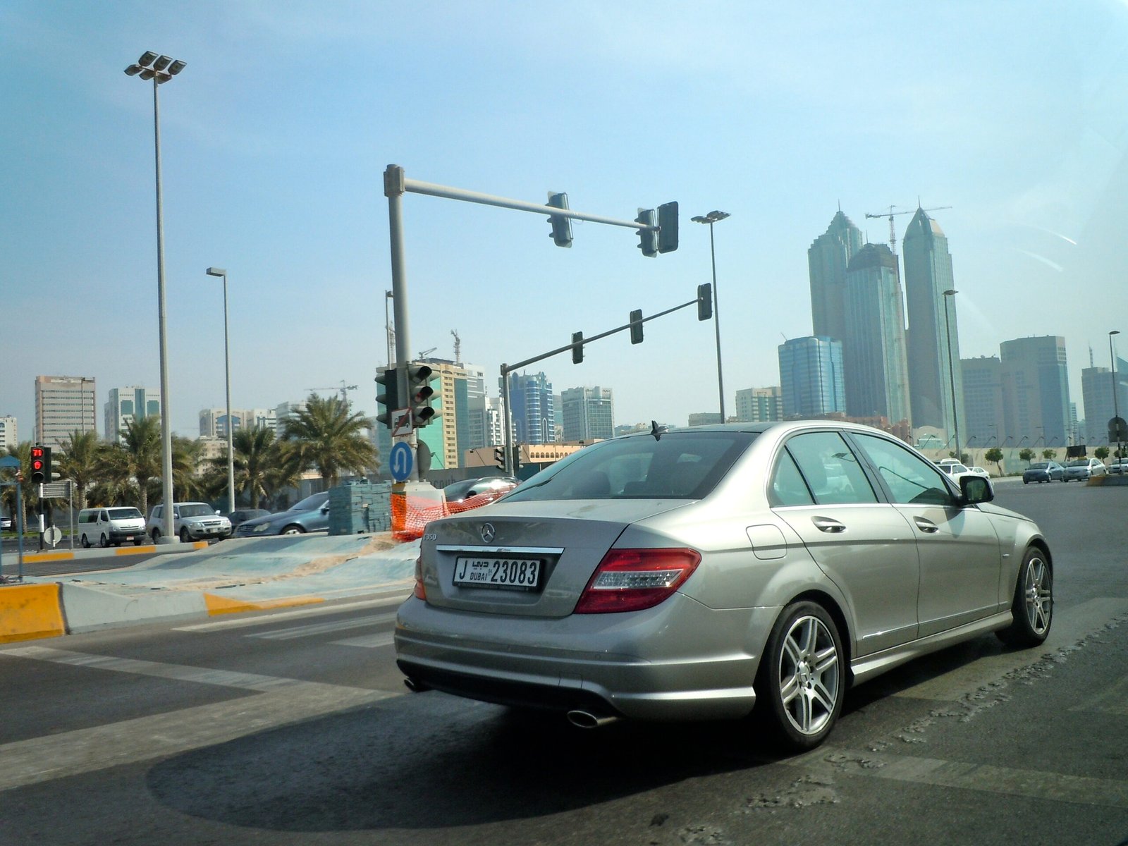 Street view in Abu Dhabi with the city skyline, the home base of Dr Shamsheer Vayalil and Burjeel Holdings