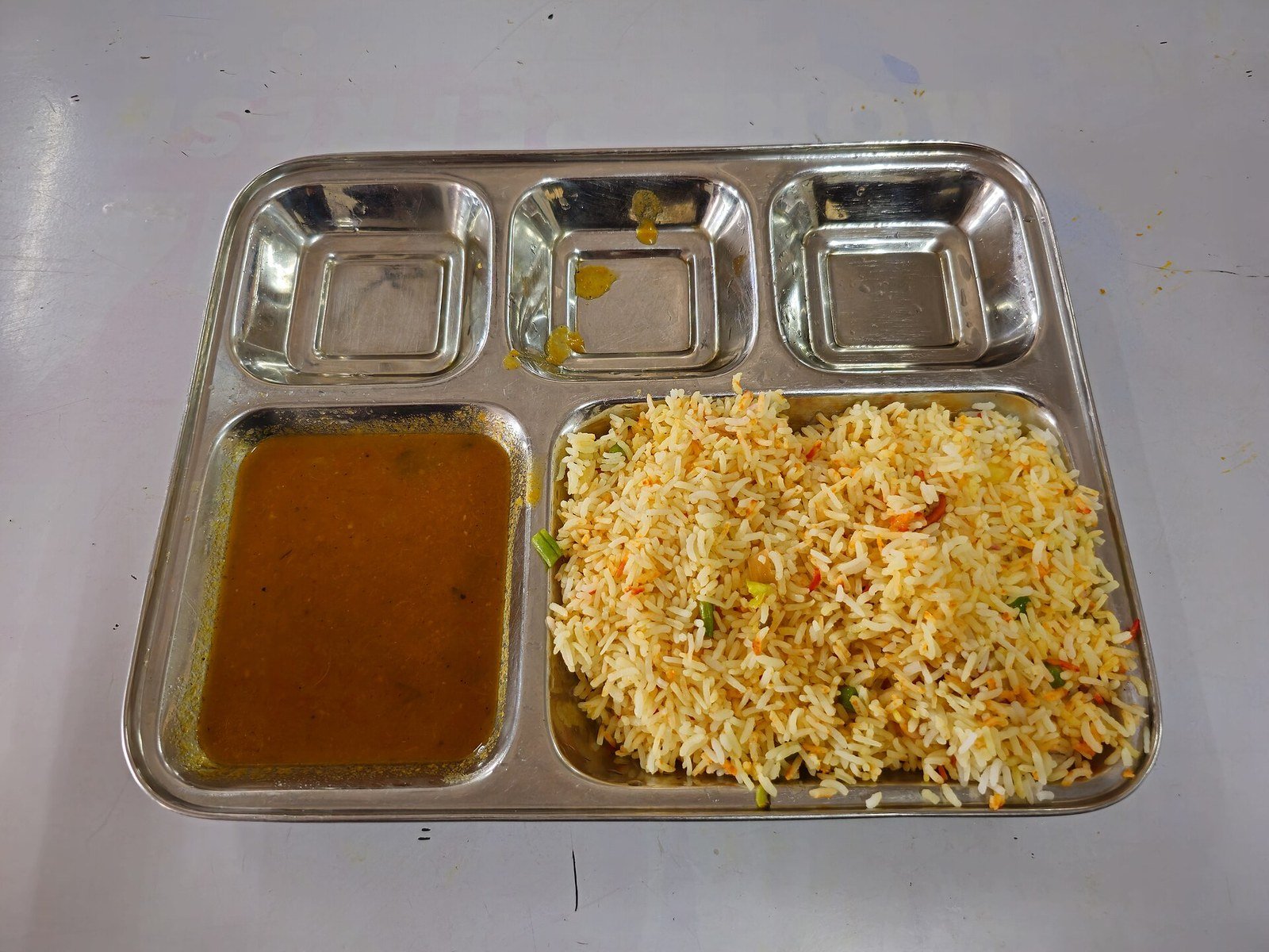 A serving of biryani with fragrant saffron rice