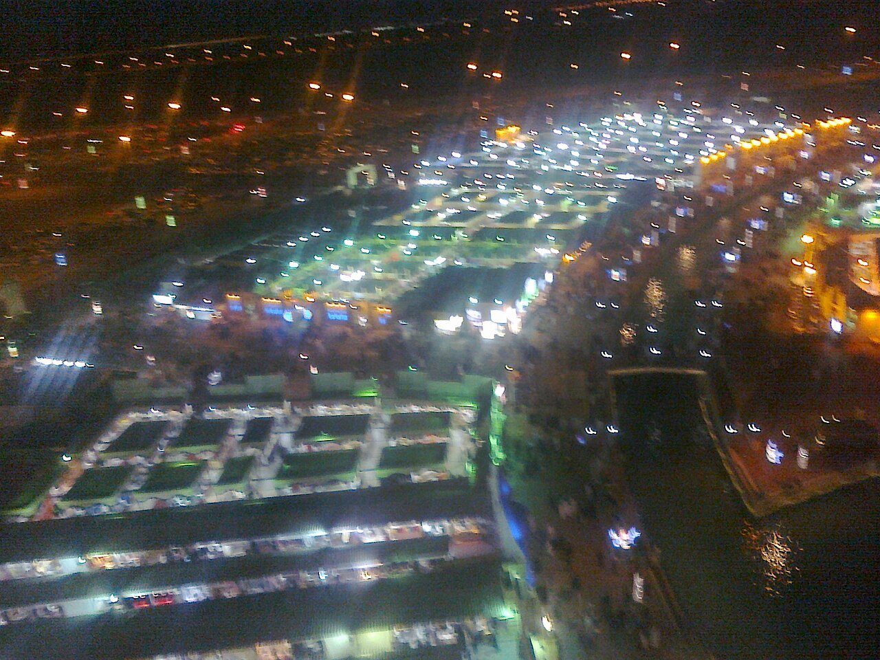 Global Village Dubai illuminated at night during opening hours