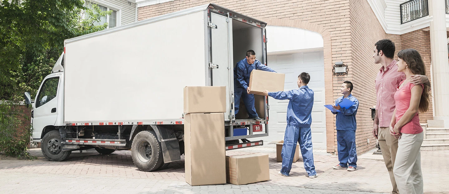 Movers and packers Dubai team loading furniture onto a moving truck